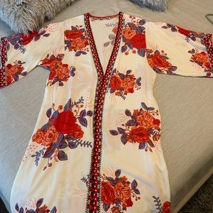 Kimono beach cover up or can be worn as a robe. White with red,orange and blue